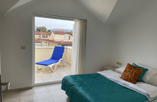 Fethiye City Center Villa | 3 bedroom beach front holiday home with shared pool and seaviews