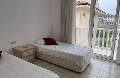 Fethiye City Center Villa | 3 bedroom beach front holiday home with shared pool and seaviews