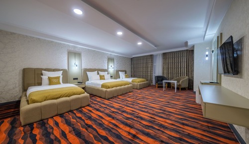 Deluxe Quadruple Room, Housekeeping, Mountain View