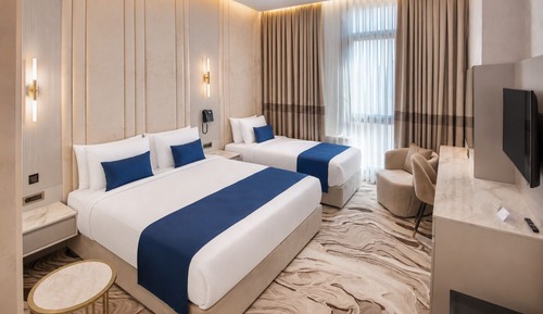 Trendy Room with 1 King + 1 Single