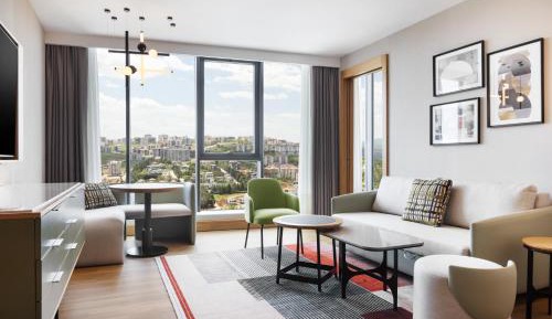 One-Bedroom King Corner Suite with Sofa Bed and City View