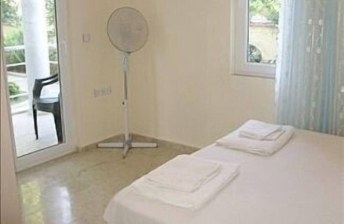 Fethiye City Center Apartment | Ground Floor Apartment With Shared Pool And Gardens