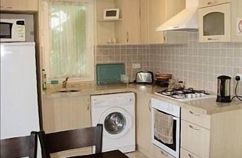 Fethiye City Center Apartment | Ground Floor Apartment With Shared Pool And Gardens