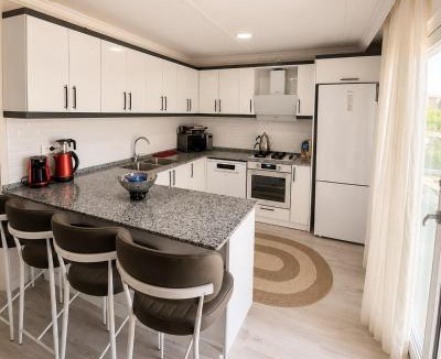 Karaoz House | Cozy Retreat Near Airport Patio & Nature